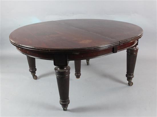 A large Victorian mahogany extending dining table with four leaves 4ft 6in. extends to 12ft 5in.